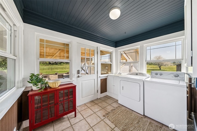 28009 SE 456th St, Enumclaw, WA 98022 - washroom with washing machine and clothes dryer, light tile patterned floors, healthy amount of natural light, and wood ceiling
