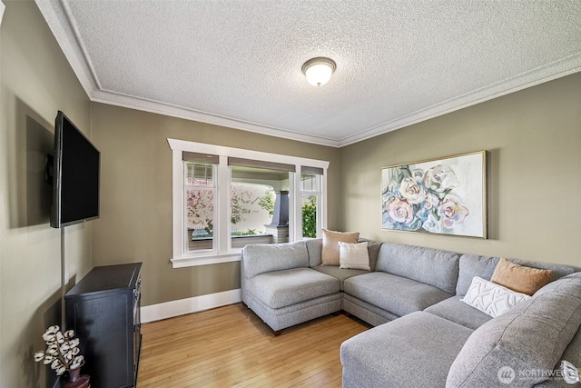28009 SE 456th St, Enumclaw, WA 98022 - living area featuring ornamental molding, light wood-type flooring, a textured ceiling, and baseboards