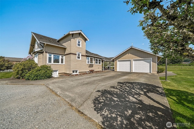 28009 SE 456th St, Enumclaw, WA 98022 - view of side of home featuring an outdoor structure, a detached garage, and a lawn
