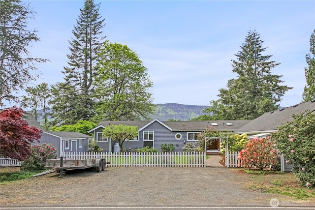47 W Sunny Sands Rd, Cathlamet, WA 98612 - single story home with a mountain view and a fenced front yard