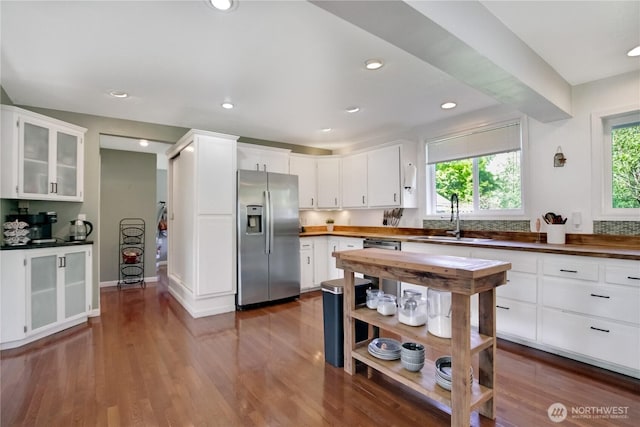 47 W Sunny Sands Rd, Cathlamet, WA 98612 - kitchen featuring glass insert cabinets, a sink, stainless steel refrigerator with ice dispenser, white cabinetry, and dark wood finished floors