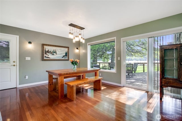 47 W Sunny Sands Rd, Cathlamet, WA 98612 - dining space featuring baseboards, an inviting chandelier, and wood-type flooring