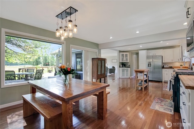 47 W Sunny Sands Rd, Cathlamet, WA 98612 - dining space featuring light wood finished floors, a chandelier, baseboards, and recessed lighting