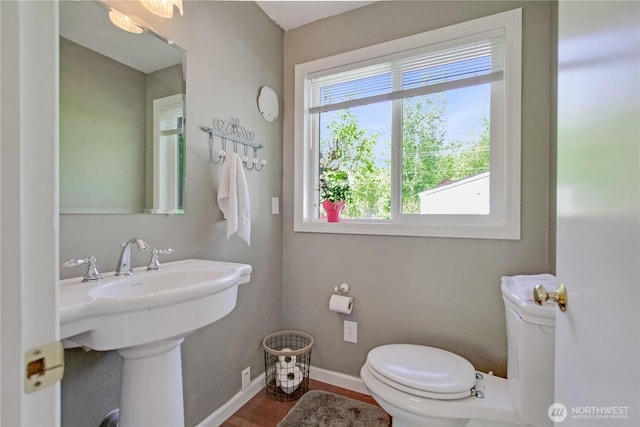 47 W Sunny Sands Rd, Cathlamet, WA 98612 - bathroom featuring toilet, baseboards, wood finished floors, and a sink