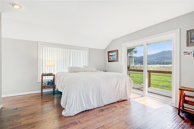 47 W Sunny Sands Rd, Cathlamet, WA 98612 - bedroom with a mountain view, wood finished floors, access to exterior, baseboards, and lofted ceiling