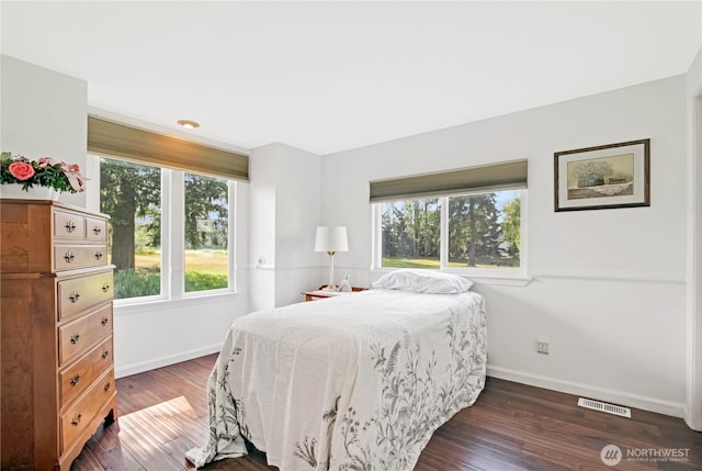 47 W Sunny Sands Rd, Cathlamet, WA 98612 - bedroom featuring dark wood finished floors, visible vents, and baseboards