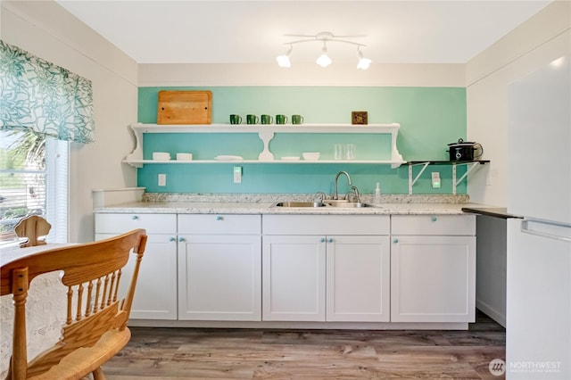 47 W Sunny Sands Rd, Cathlamet, WA 98612 - kitchen featuring white cabinetry, open shelves, light wood-type flooring, and a sink