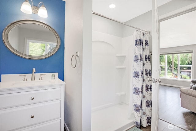 47 W Sunny Sands Rd, Cathlamet, WA 98612 - full bath with vanity, a shower with shower curtain, and wood finished floors