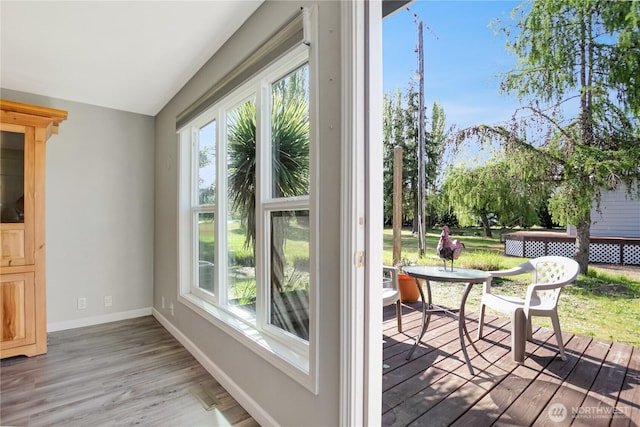 47 W Sunny Sands Rd, Cathlamet, WA 98612 - doorway with baseboards, vaulted ceiling, and wood finished floors