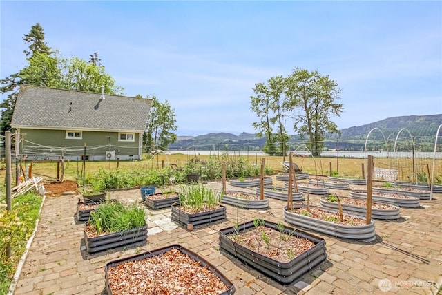 47 W Sunny Sands Rd, Cathlamet, WA 98612 - view of patio featuring a vegetable garden, a mountain view, and fence