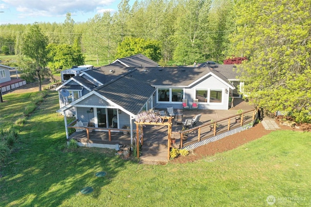 47 W Sunny Sands Rd, Cathlamet, WA 98612 - back of house with a yard, a view of trees, roof with shingles, and fence