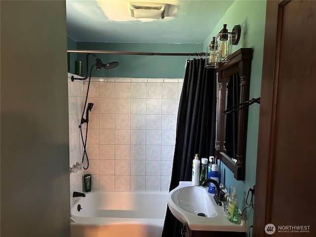 full bath with vanity, shower / tub combo with curtain, and visible vents