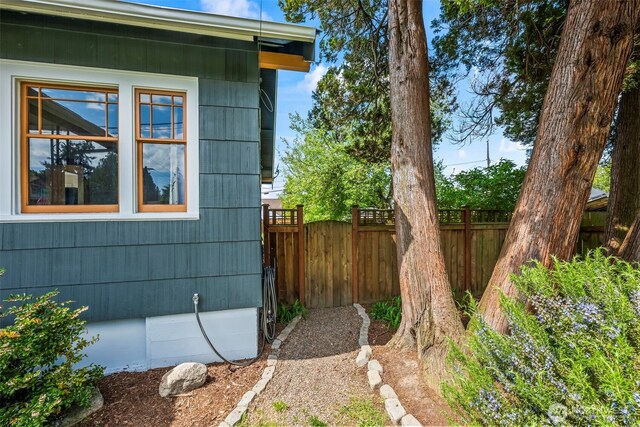 view of side of property with fence