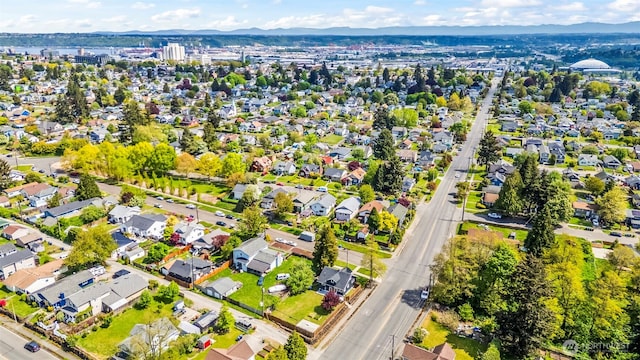 birds eye view of property featuring a mountain view and a residential view