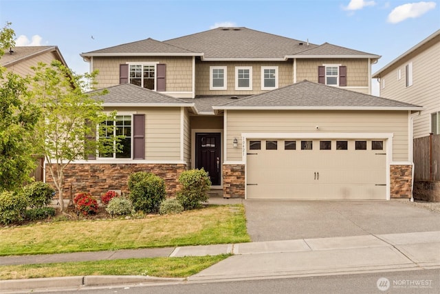 10421 12th St E, Edgewood, WA 98372 - view of front of home featuring stone siding, asphalt driveway, an attached garage, and a shingled roof