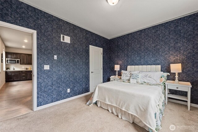 carpeted bedroom featuring baseboards