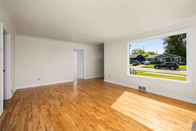 6027 S Bell St, Tacoma, WA 98408 - empty room with hardwood / wood-style floors and baseboards