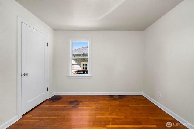 6027 S Bell St, Tacoma, WA 98408 - unfurnished room featuring hardwood / wood-style flooring and baseboards