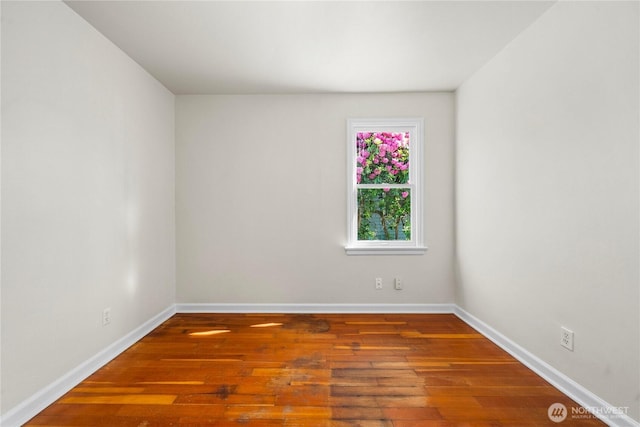 6027 S Bell St, Tacoma, WA 98408 - unfurnished room featuring wood-type flooring and baseboards