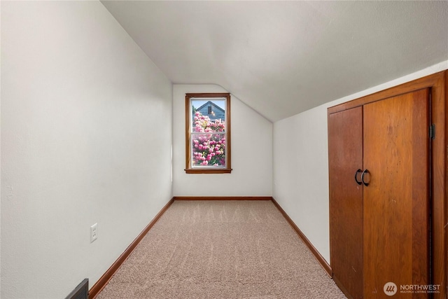 6027 S Bell St, Tacoma, WA 98408 - bonus room with lofted ceiling, light carpet, and baseboards