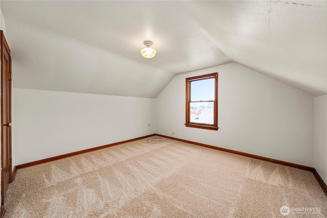 6027 S Bell St, Tacoma, WA 98408 - bonus room with baseboards, carpet floors, and lofted ceiling