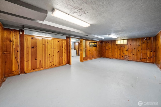 6027 S Bell St, Tacoma, WA 98408 - below grade area with washer / dryer, a textured ceiling, and wooden walls