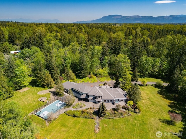 aerial view with a forest view and a mountain view