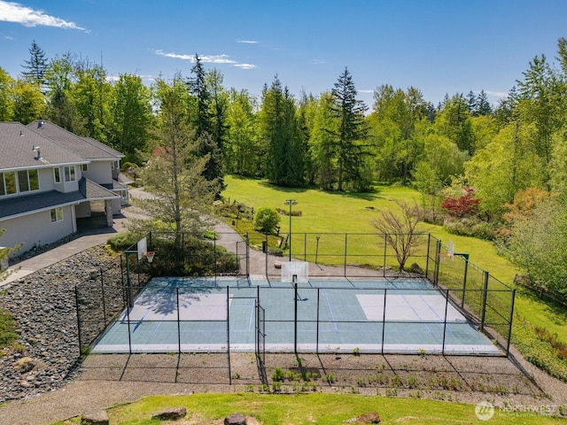 exterior space with a lawn and fence