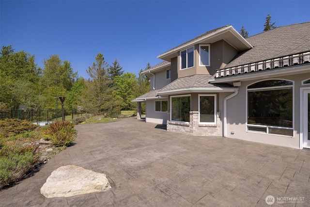 view of patio / terrace with fence and a balcony