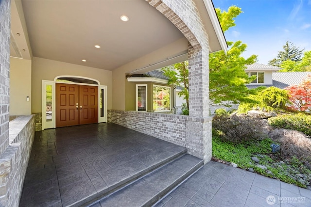 exterior space with recessed lighting and stone tile flooring