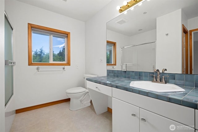 full bathroom featuring vanity, toilet, an enclosed shower, and visible vents