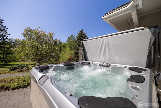 exterior details featuring a hot tub