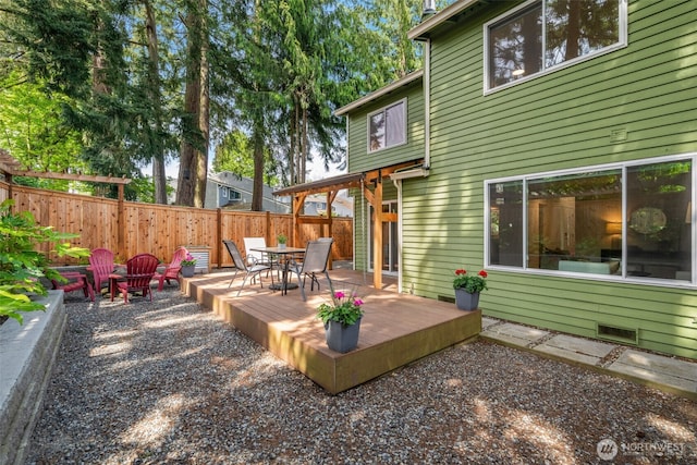 deck featuring fence and outdoor dining space
