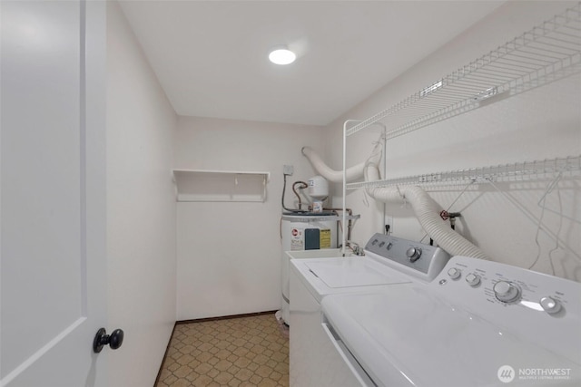 18215 3rd Pl SW, Normandy Park, WA 98166 - laundry area featuring washer and dryer, tile patterned floors, and baseboards