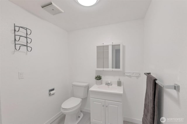 18215 3rd Pl SW, Normandy Park, WA 98166 - bathroom with toilet, baseboards, and vanity