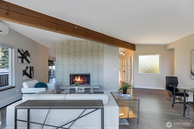 18215 3rd Pl SW, Normandy Park, WA 98166 - living room featuring beam ceiling, wood finished floors, a brick fireplace, and baseboards