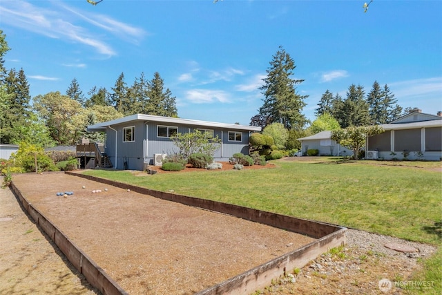 18215 3rd Pl SW, Normandy Park, WA 98166 - back of house featuring a lawn, board and batten siding, and a deck