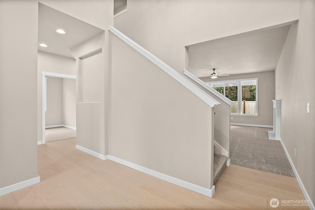 staircase with ceiling fan, wood finished floors, baseboards, and recessed lighting