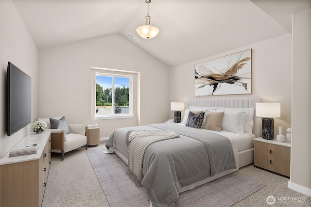 bedroom with light carpet, lofted ceiling, and baseboards
