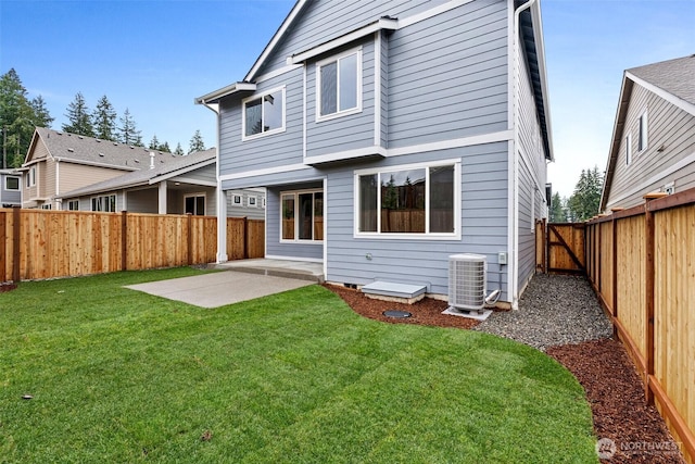 rear view of house featuring central AC unit and a patio