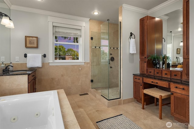 full bathroom with a stall shower, a whirlpool tub, vanity, ornamental molding, and tile patterned flooring