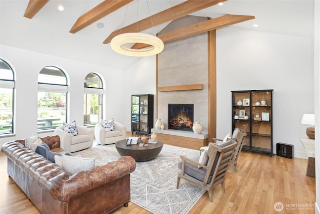 1502 Ironwood Dr, Walla Walla, WA 99362 - living room with light wood finished floors, beam ceiling, a fireplace, and high vaulted ceiling