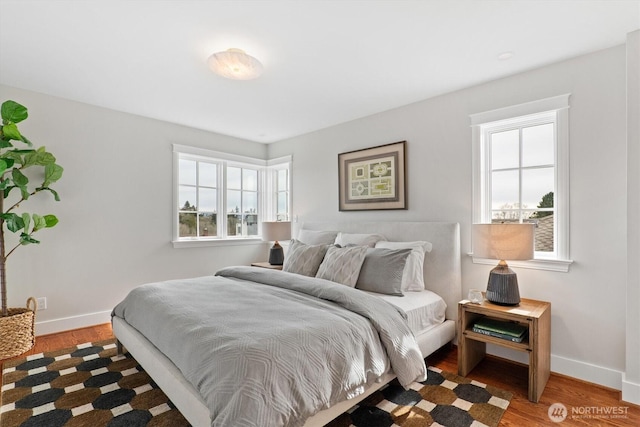 1915 35th Ave W, Seattle, WA 98199 - bedroom with multiple windows, baseboards, and wood finished floors