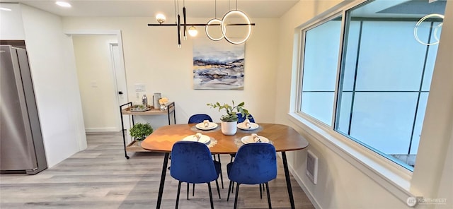 1442 E 31st St, Tacoma, WA 98404 - dining room with visible vents, light wood-style floors, baseboards, recessed lighting, and a chandelier