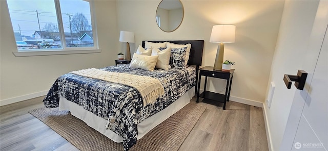 1442 E 31st St, Tacoma, WA 98404 - bedroom featuring baseboards and wood finished floors