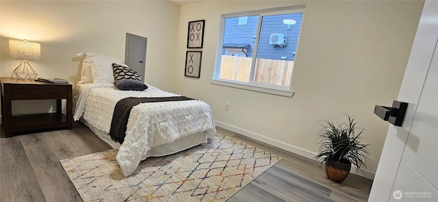 1442 E 31st St, Tacoma, WA 98404 - bedroom with baseboards and wood finished floors
