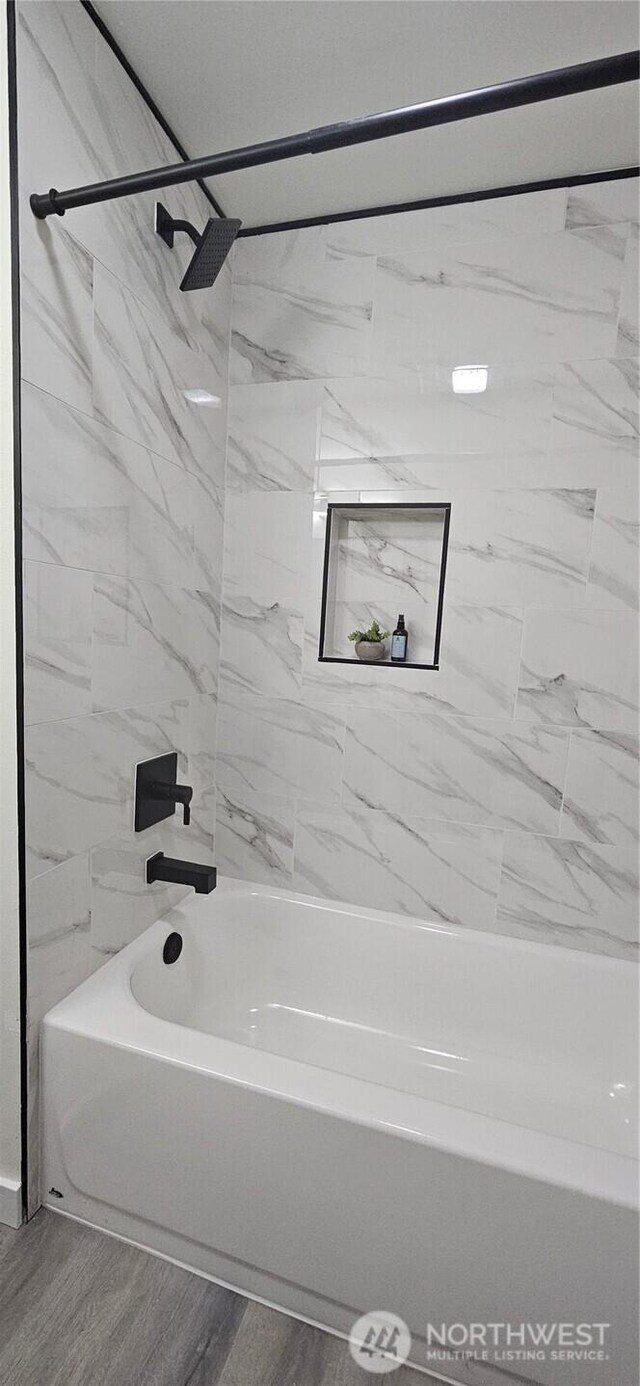 1442 E 31st St, Tacoma, WA 98404 - bathroom featuring bathing tub / shower combination and wood finished floors