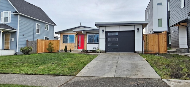 1442 E 31st St, Tacoma, WA 98404 - view of front of house featuring a garage, fence, concrete driveway, and a front yard