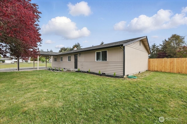 ranch-style home featuring a carport
