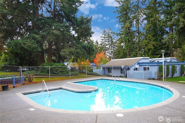 community pool featuring fence